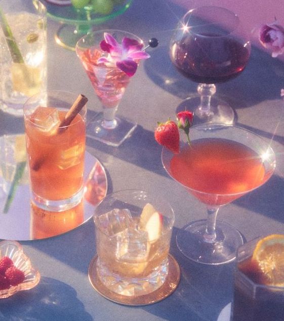 colourful image of assorted vintage glassware, cocktails and snacks